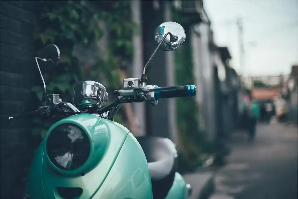 green scooter on street